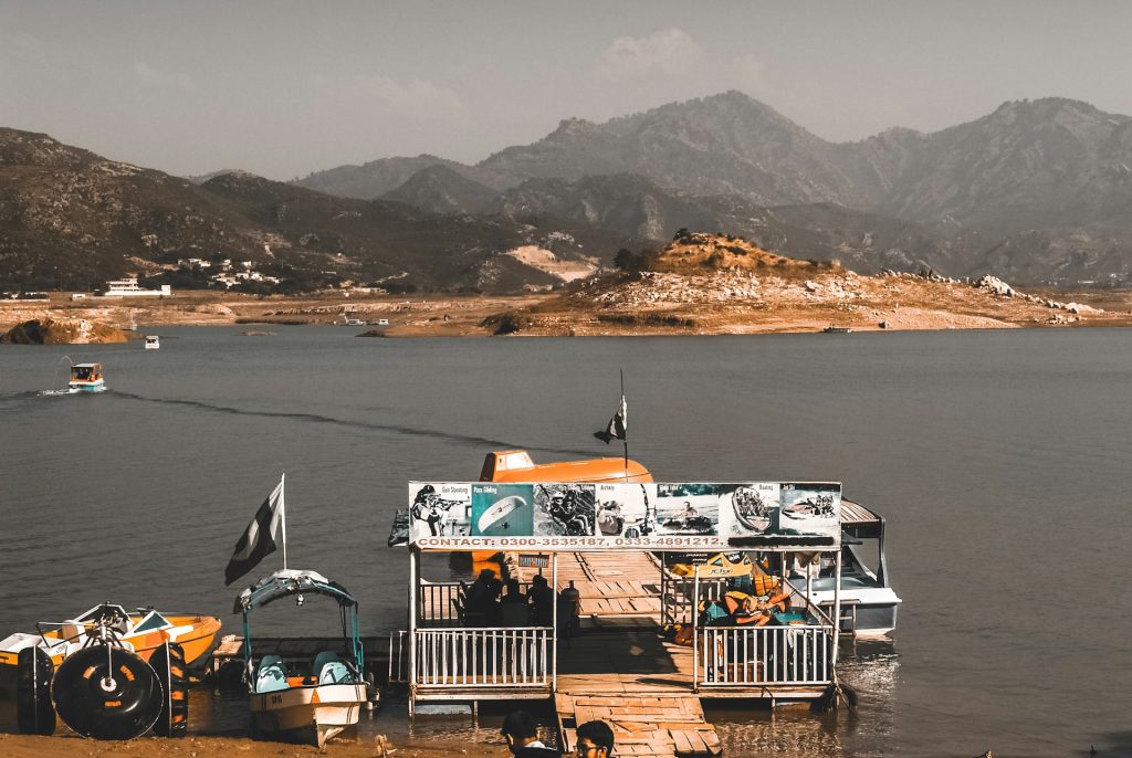 Boat on the blue water of Khanpur Dam